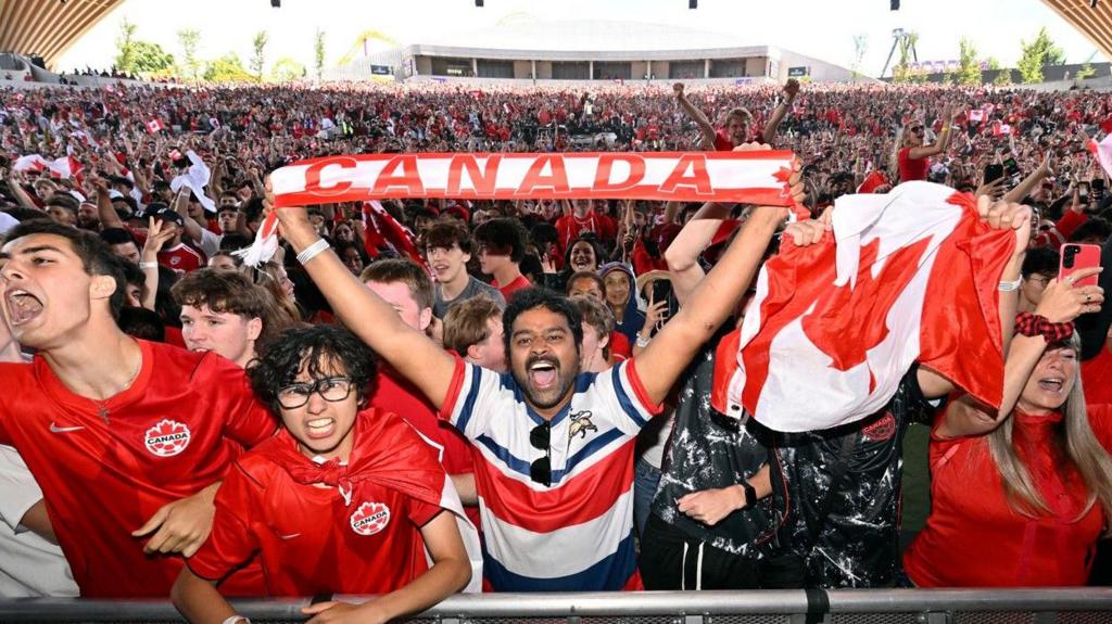 Canada players celebrate after reaching the World Cup last 16 for the first time