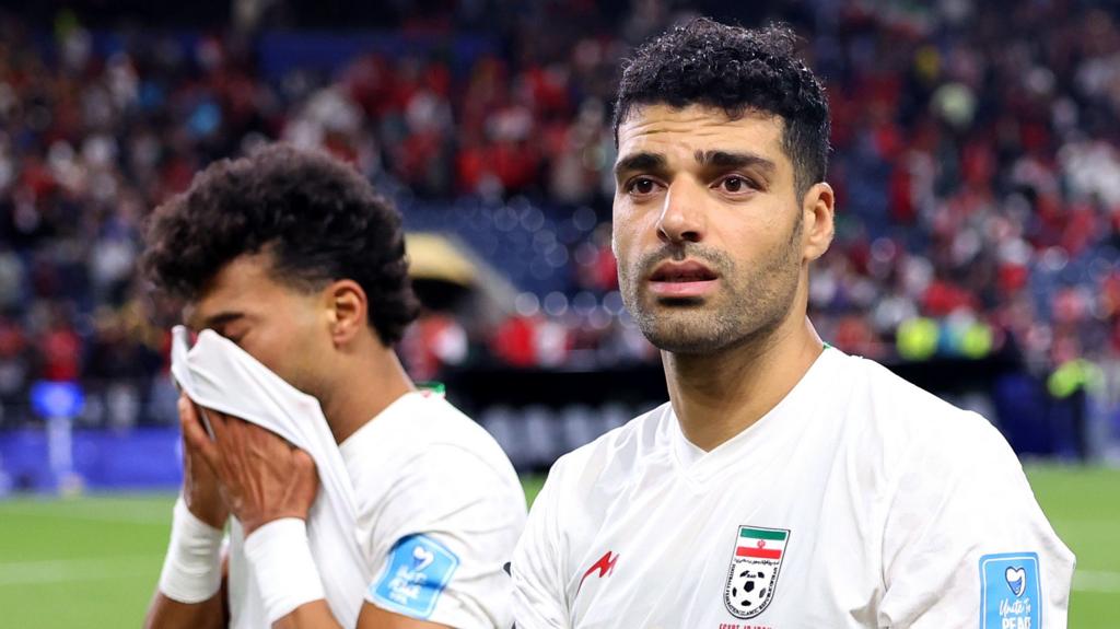 Iran players Ramin Rezaeian and Mehdi Taremi deflated after draw with Egypt at 2026 World Cup