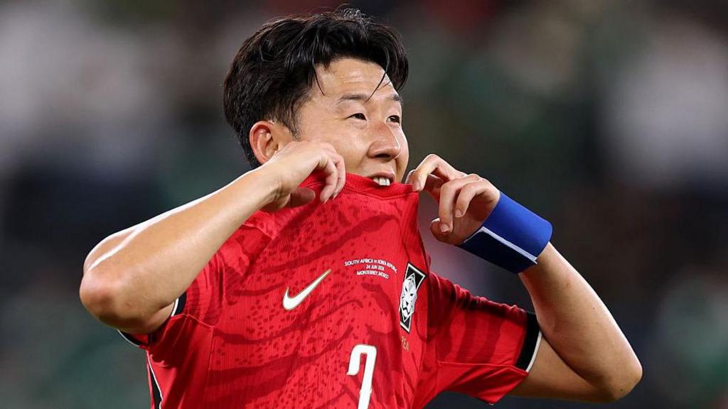 Son Heung-min bites his shirt after South Korea lose to South Africa and are knocked out of the 2026 World Cup