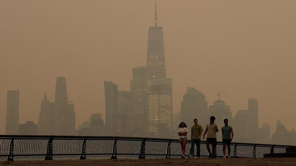 Hazy smoke-filled sky over New York City skyline from Canadian wildfires